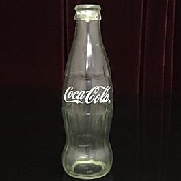 Bottiglia coka vuota che sparisce